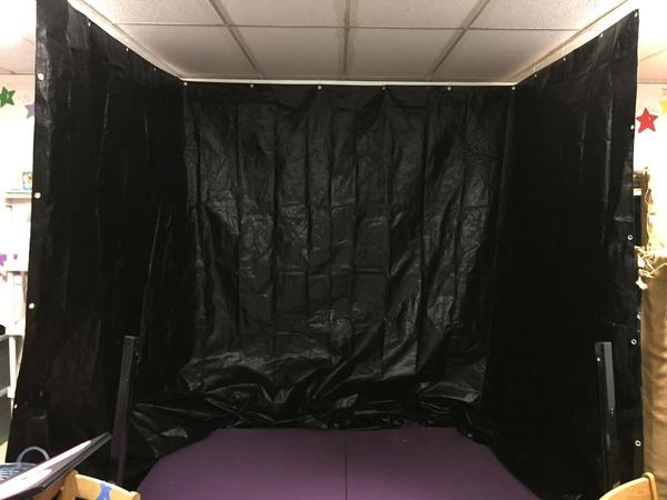 Black Tarp Hung from Ceiling