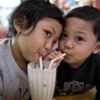 128px-Children_sharing_a_milkshake
